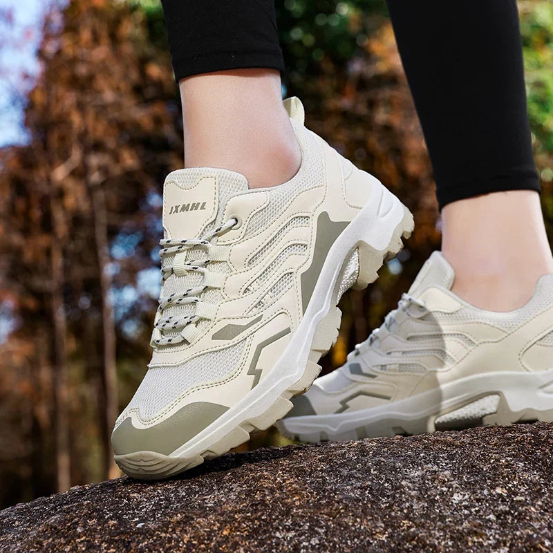 Women's waterproof hiking shoe with ankle support and tread pattern
