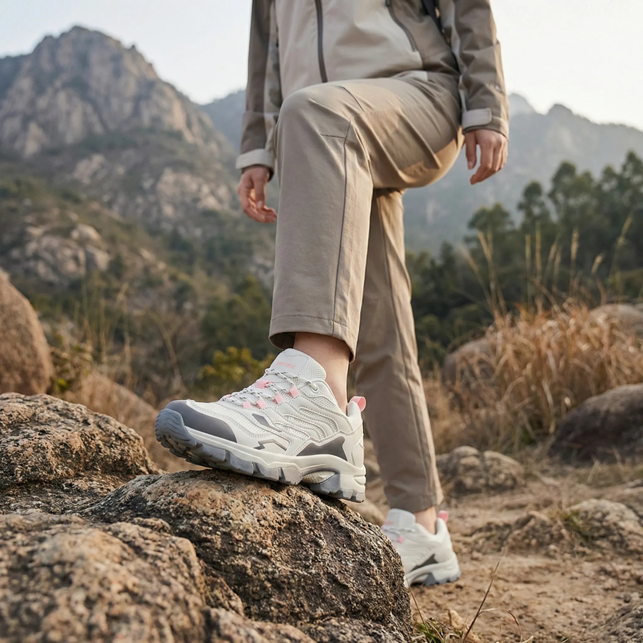 Women's waterproof hiking shoe with ankle support and tread pattern