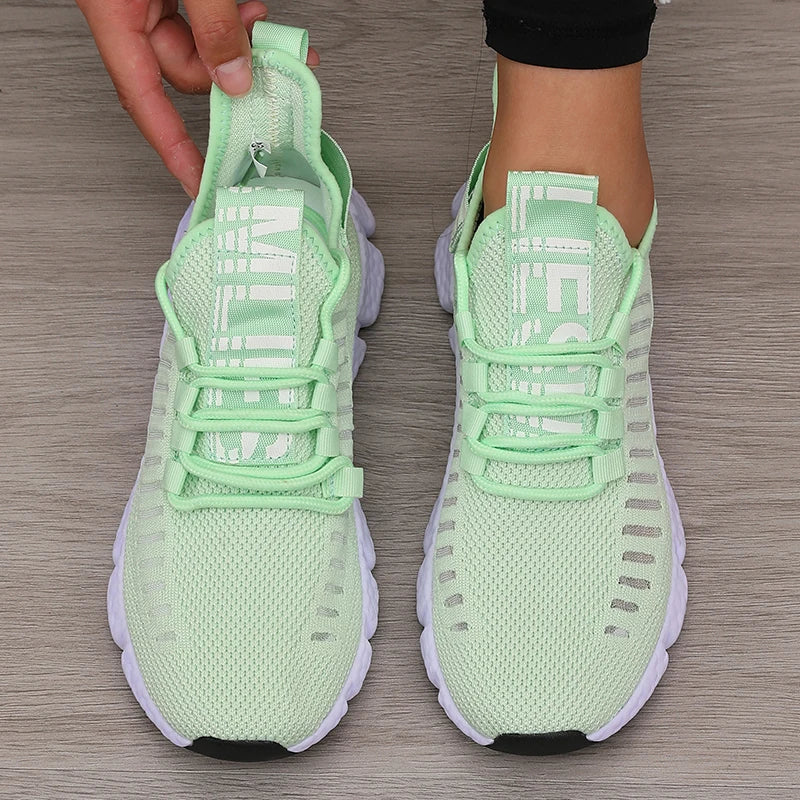 Low profile running shoe with breathable knit upper and padded sole