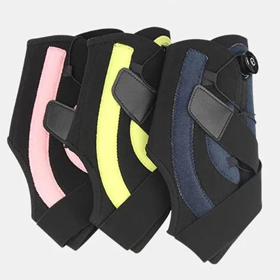 Adjustable ankle support with compression dial and lateral stabilizers