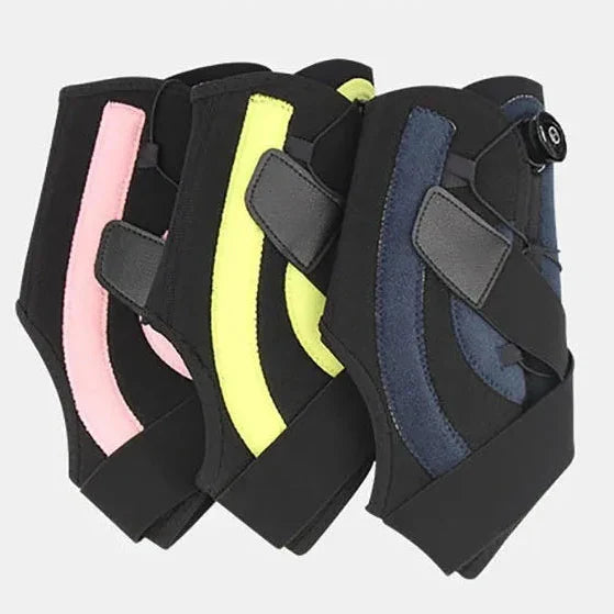 Adjustable ankle support brace with compression dial and stabilizers