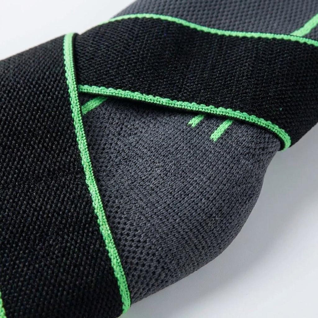 Adjustable ankle compression sleeve with stabilizing straps for sports and recovery