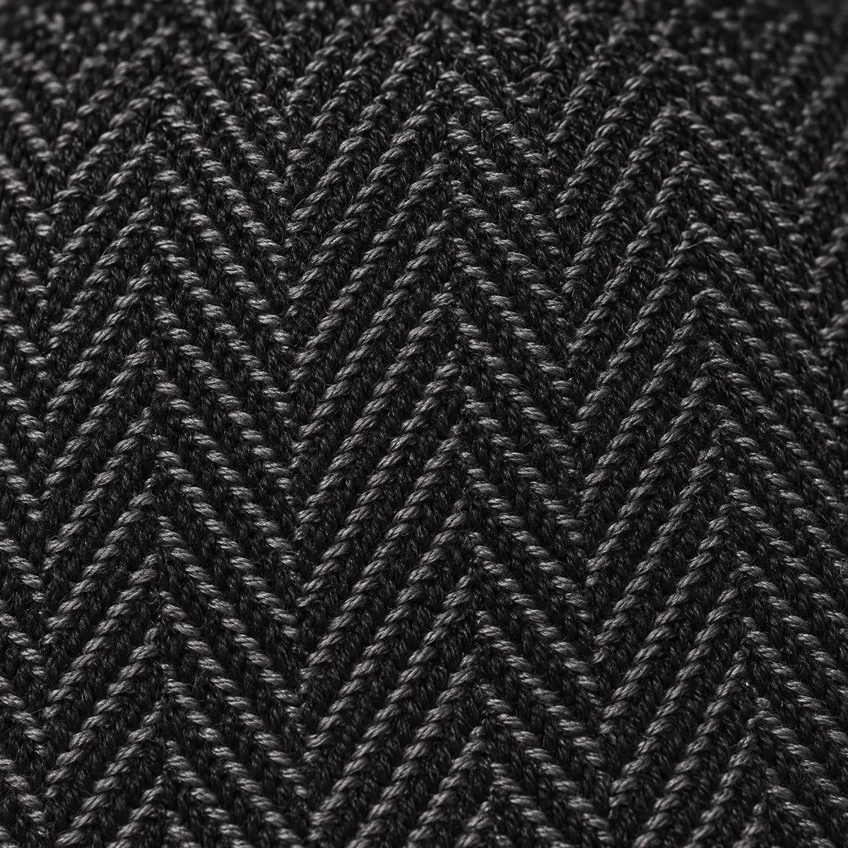 Eight-panel driver's cap with herringbone pattern and short bill