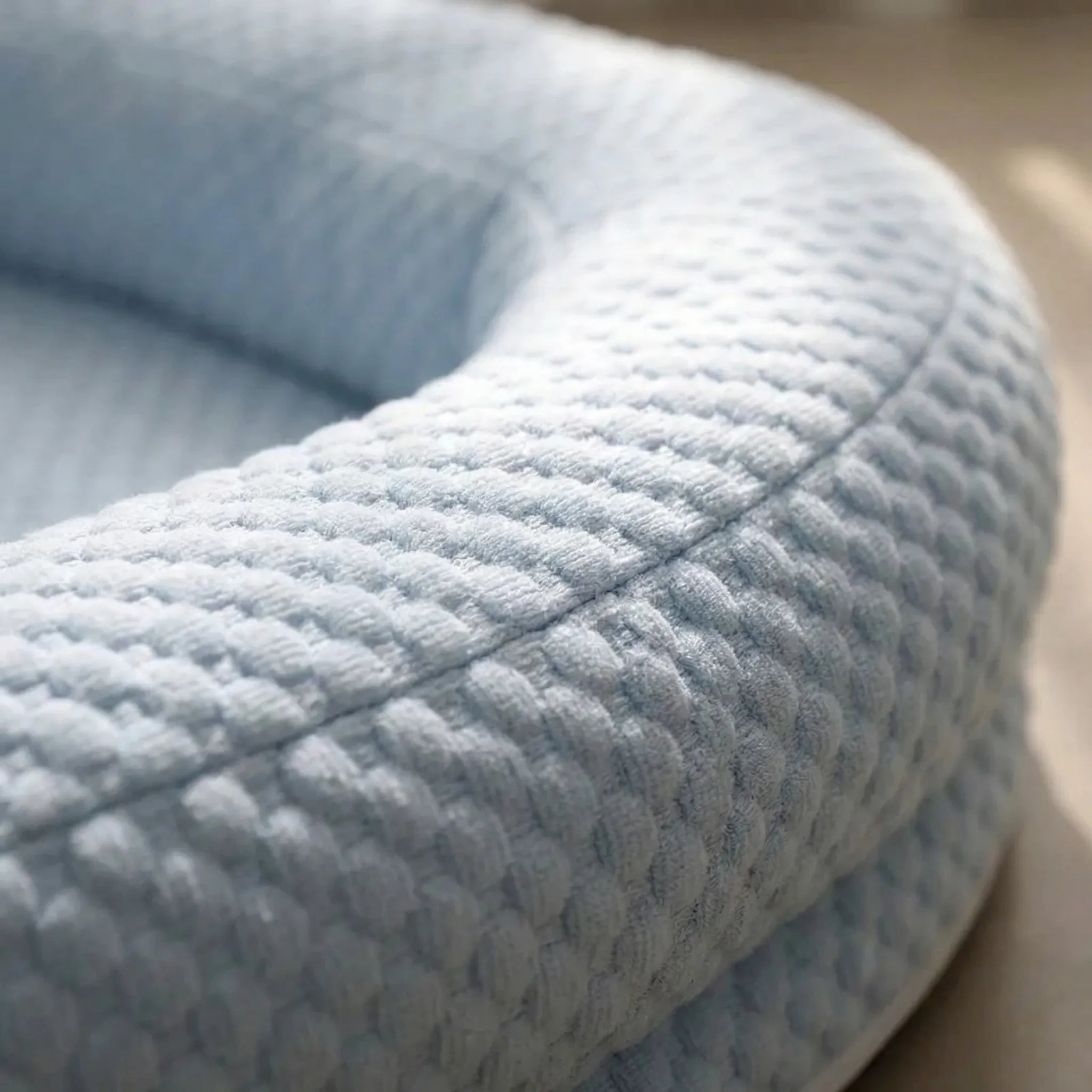 Cooling pet bed with foam base, removable washable cover and bolster headrest
