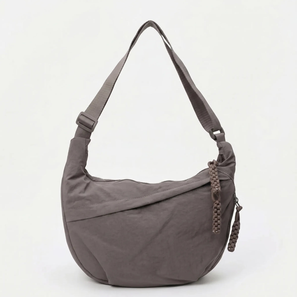 Large capacity shoulder bag with slouchy silhouette and front zip pocket