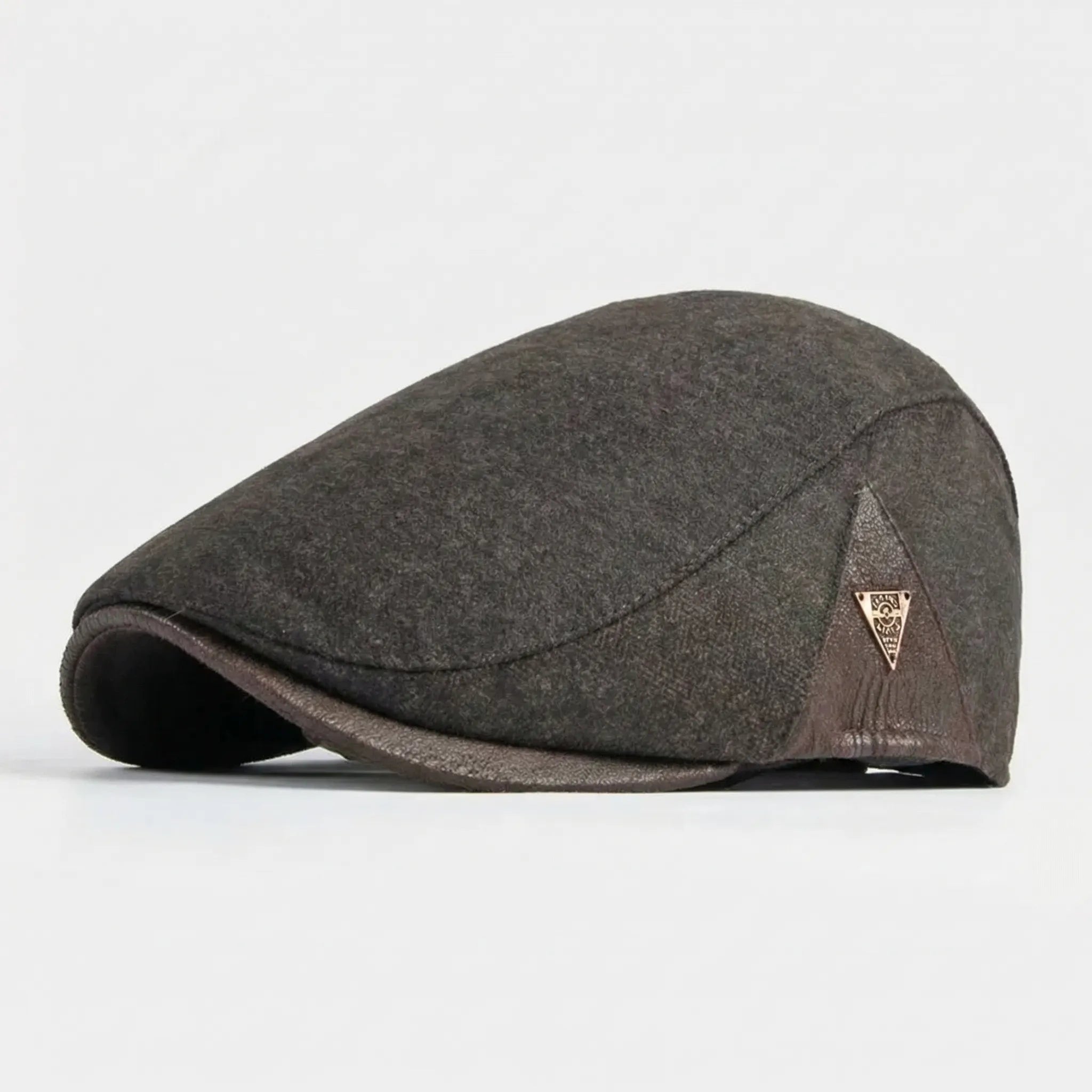 Men's herringbone flat cap with structured brim and triangular metal badge