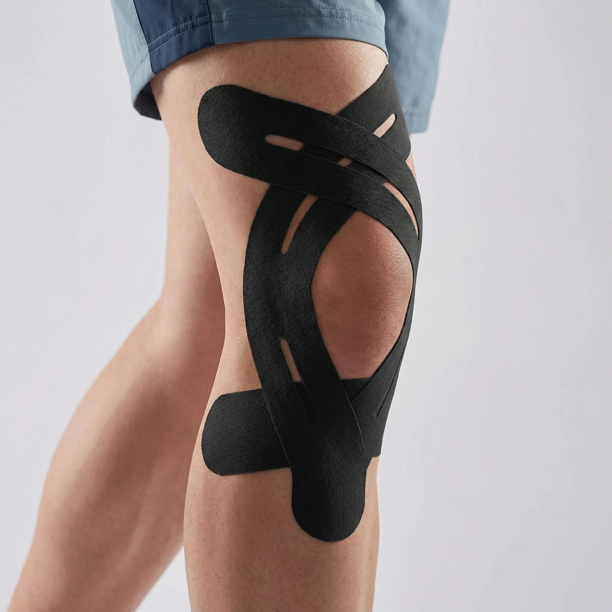 Elastic kinesiology knee tape with breathable fabric and water-resistant strips