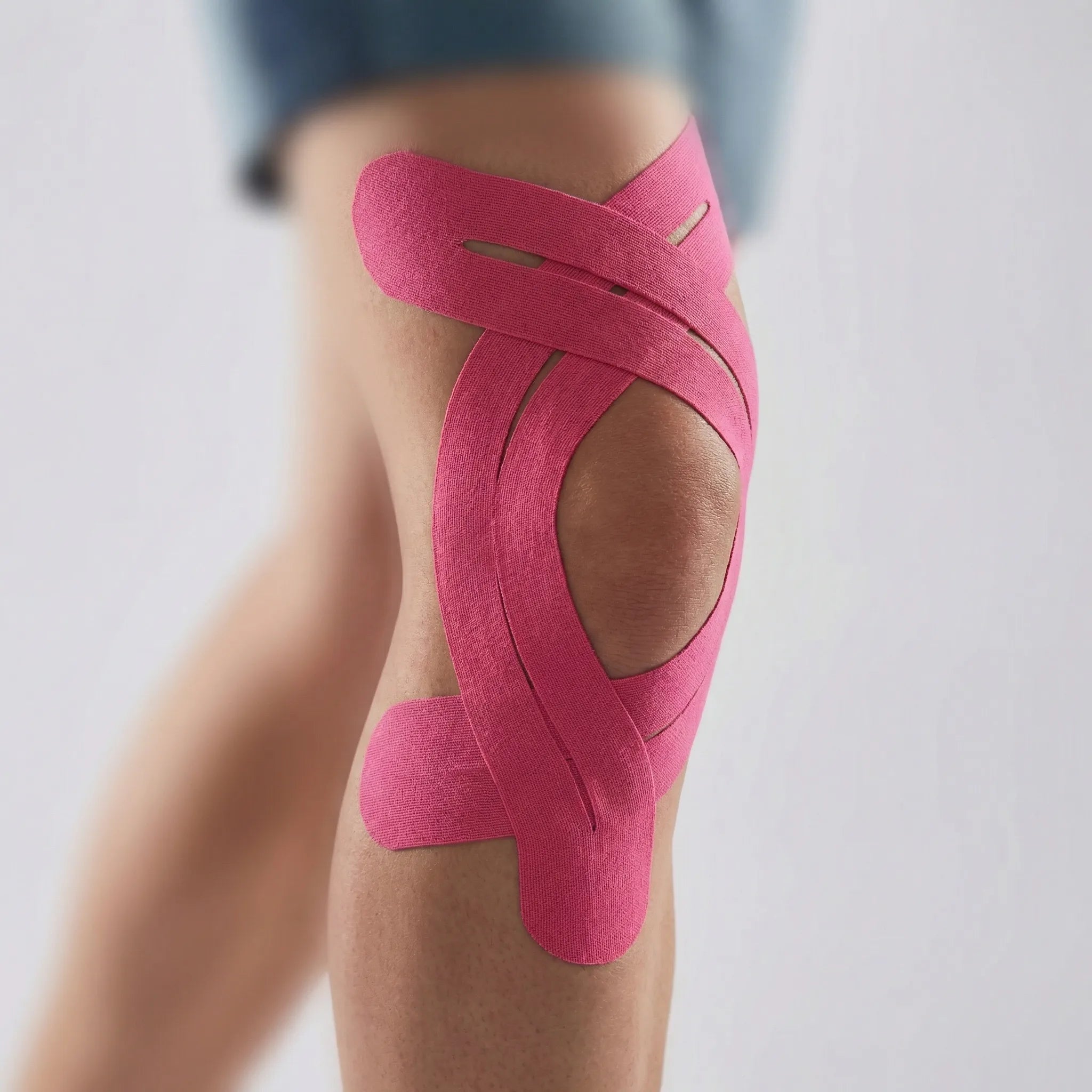 Elastic kinesiology knee tape with breathable fabric and water-resistant strips