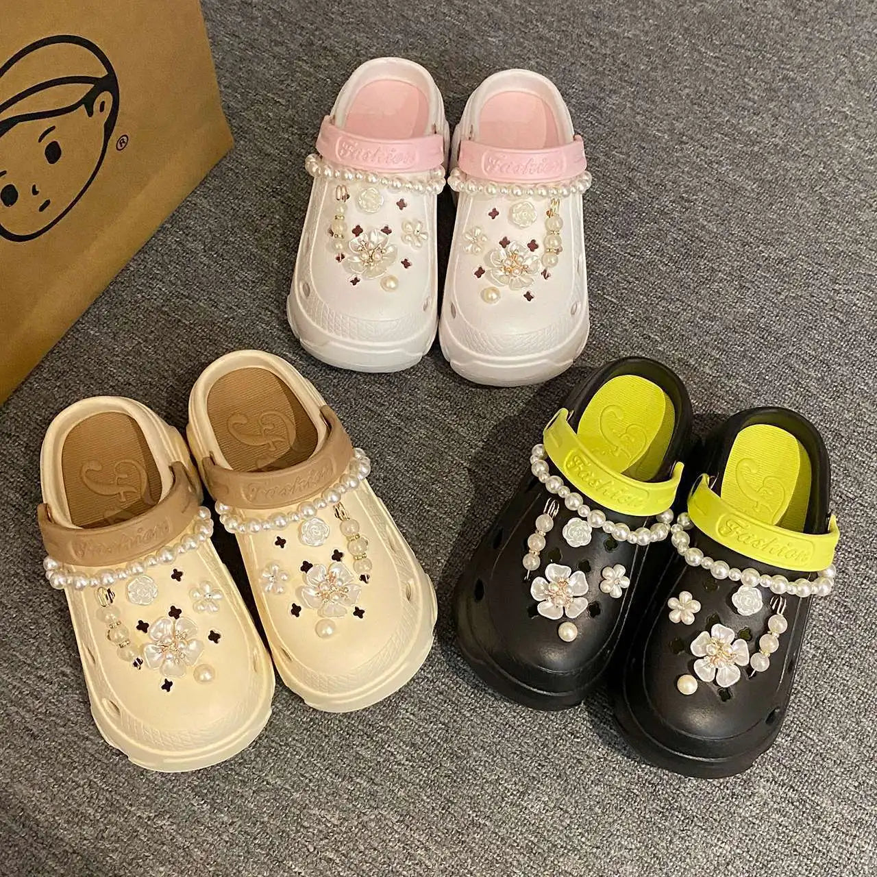 Chunky platform summer clogs with faux pearl chains and flower accents