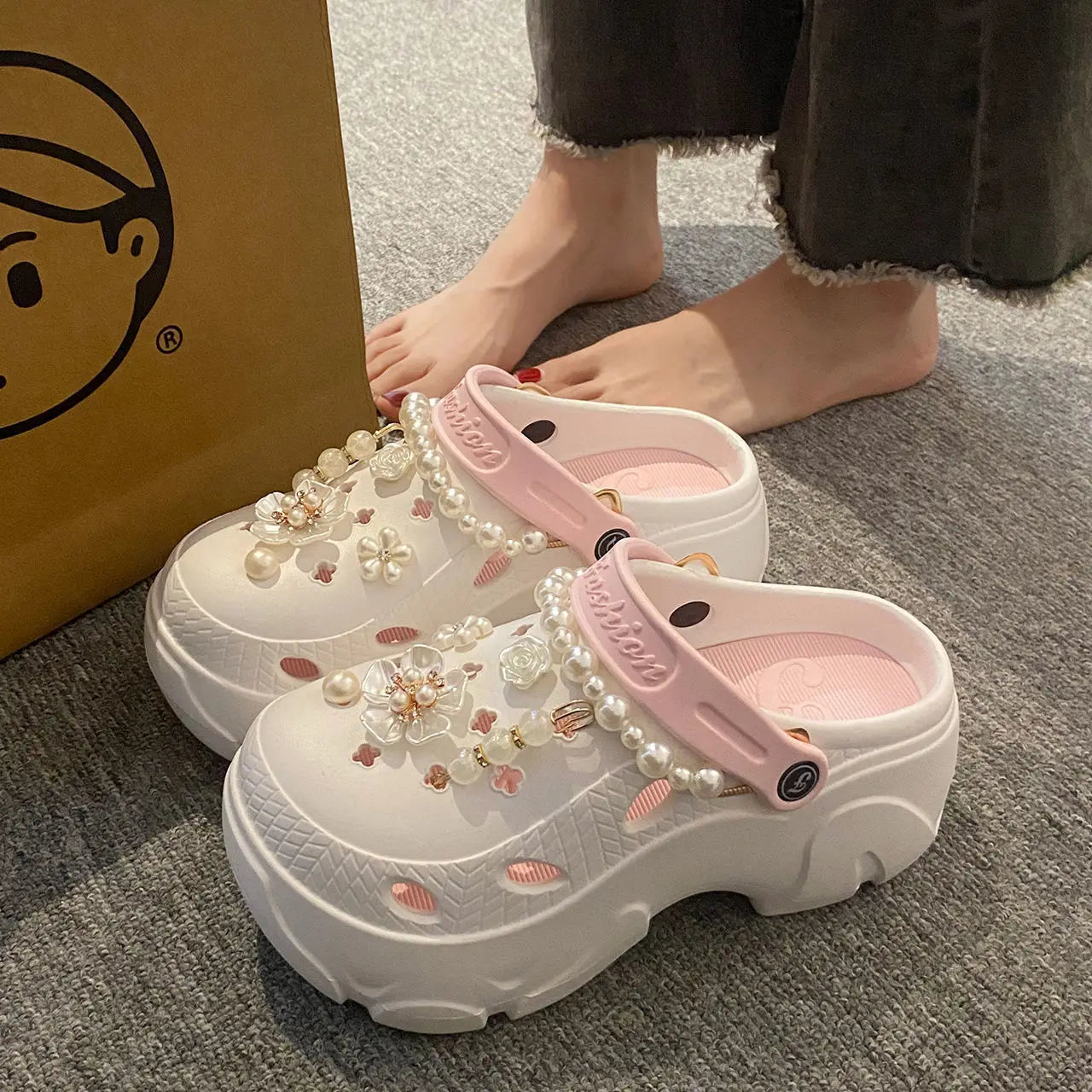 Chunky platform summer clogs with faux pearl chains and flower accents