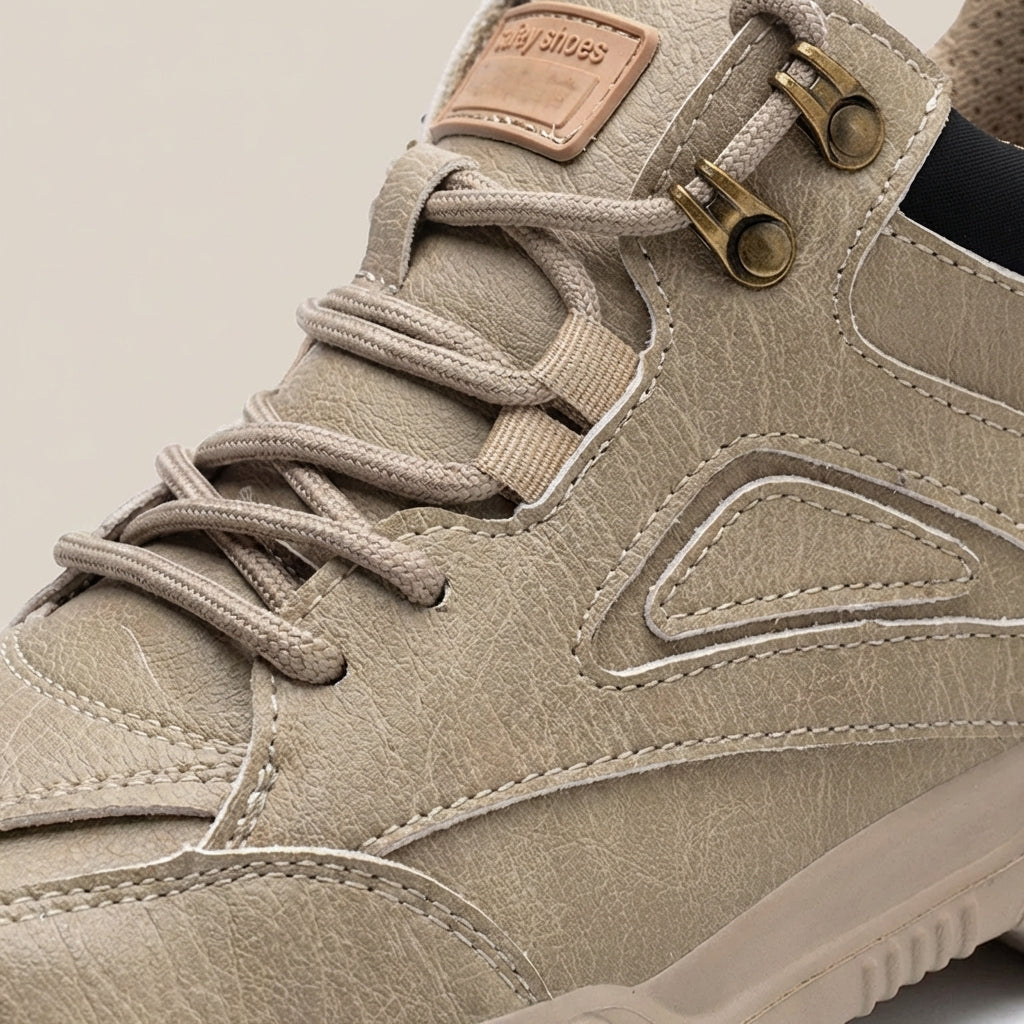 Low profile safety shoes with reinforced toe protection and slip-resistant sole