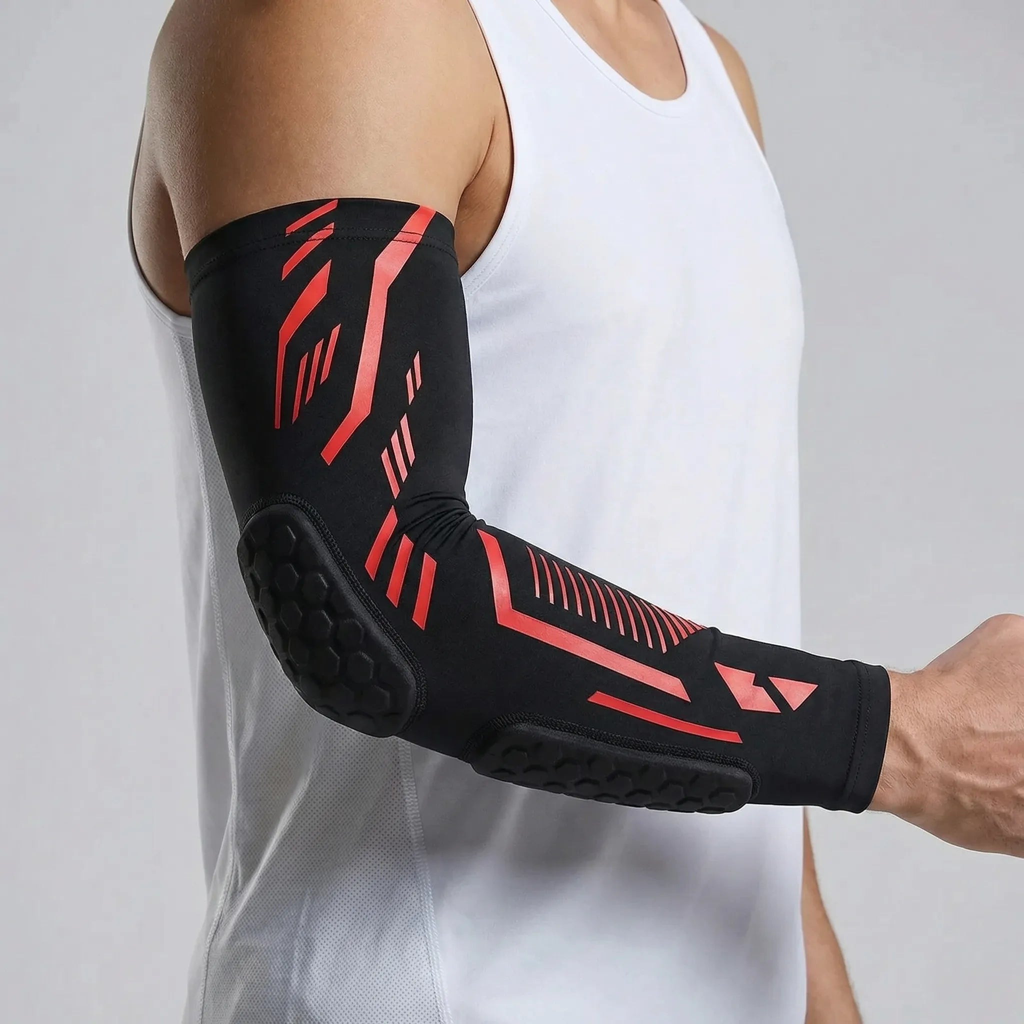 Padded compression arm sleeve with honeycomb elbow protection