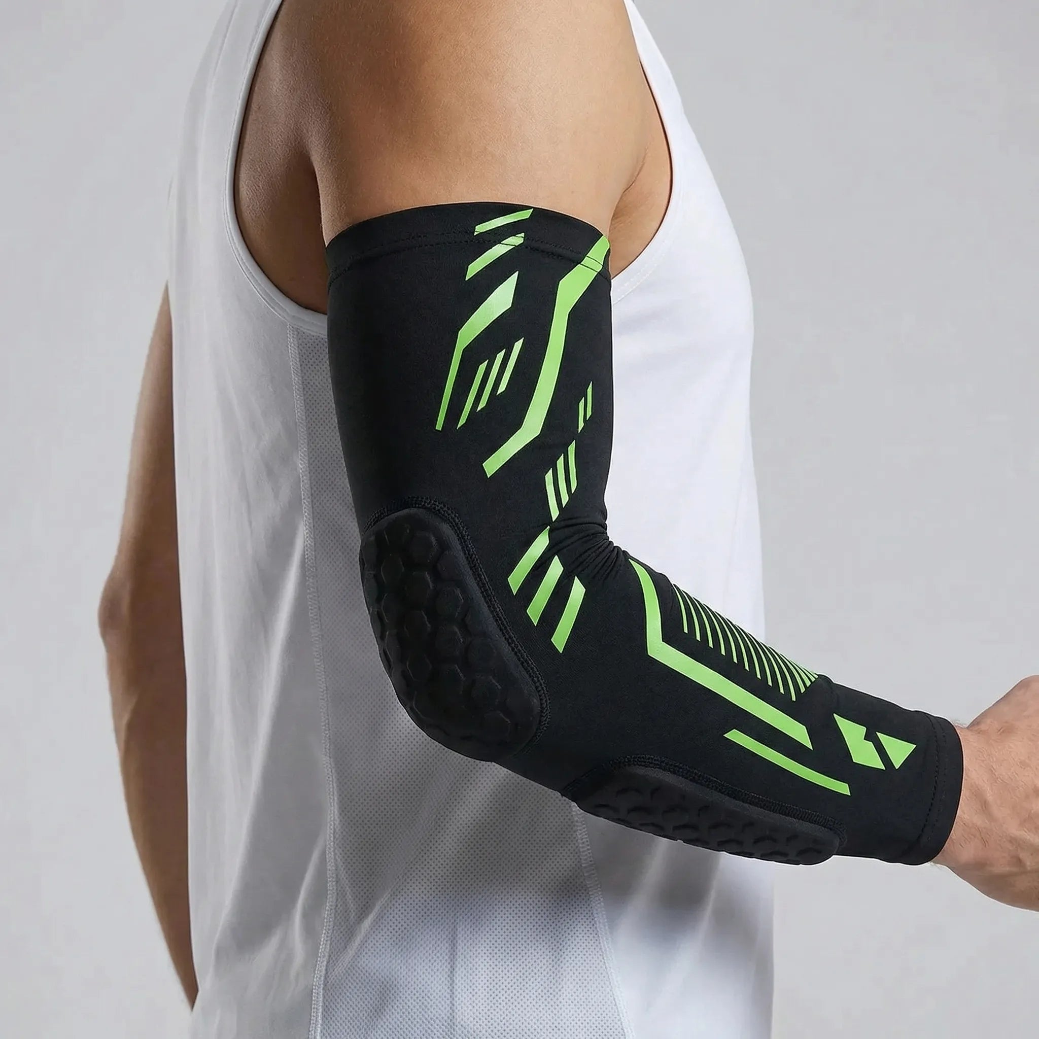 Padded compression arm sleeve with honeycomb elbow protection