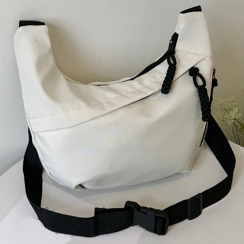 Compact crossbody sling bag with adjustable strap and organized pockets