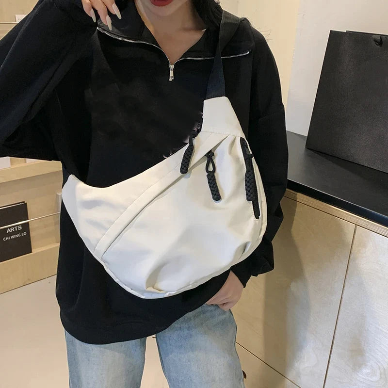 Compact crossbody sling bag with adjustable strap and organized pockets