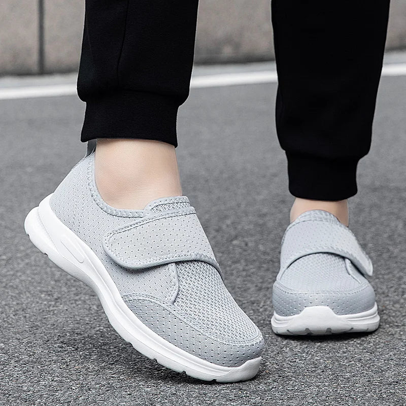 Wide fit orthopedic shoe with adjustable hook-and-loop strap