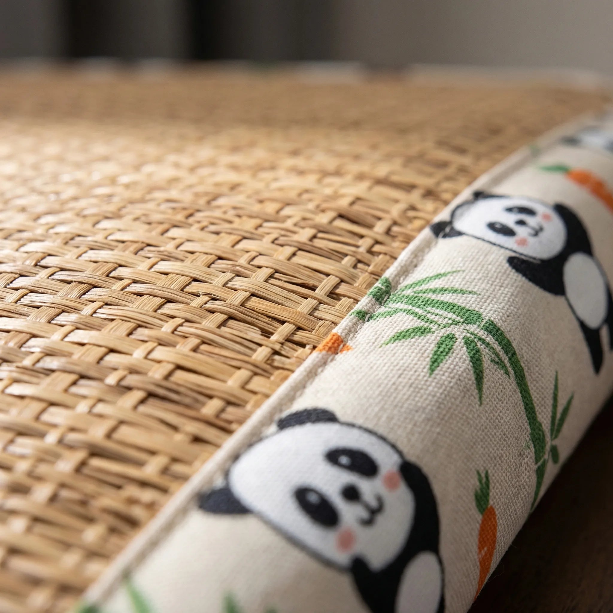 Woven rattan pet cooling mat with raised padded border