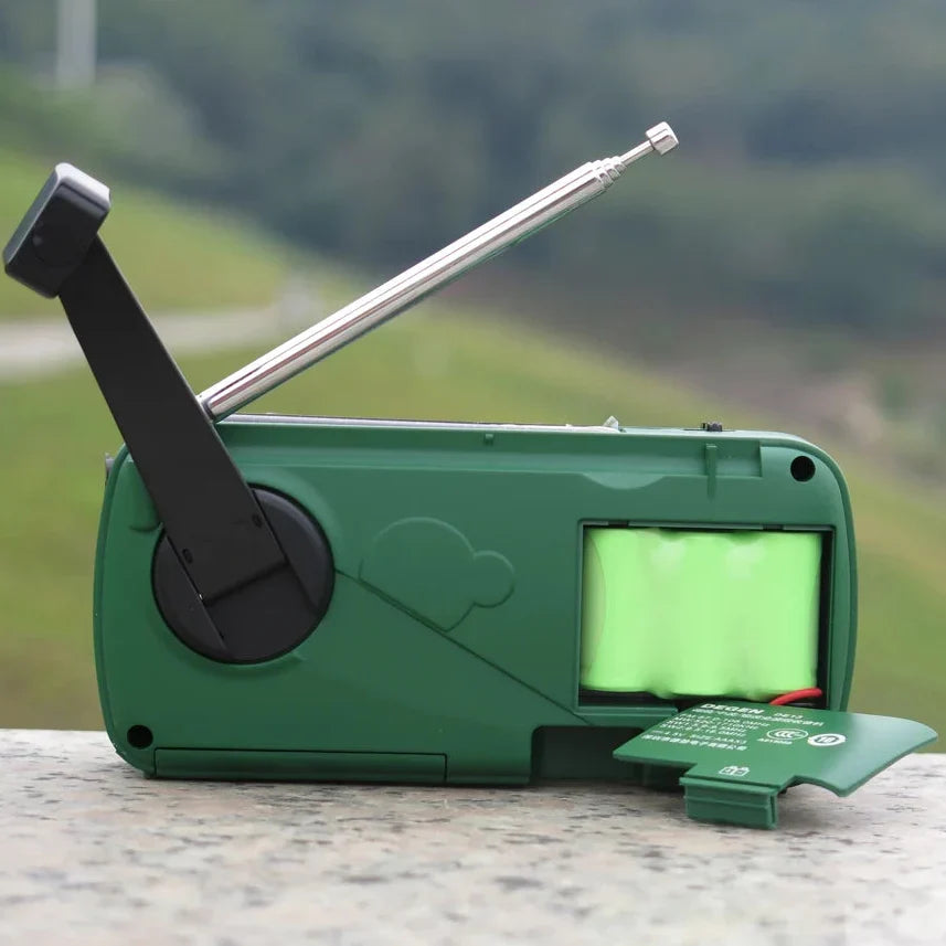 Hand crank emergency radio with built-in flashlight and USB charger