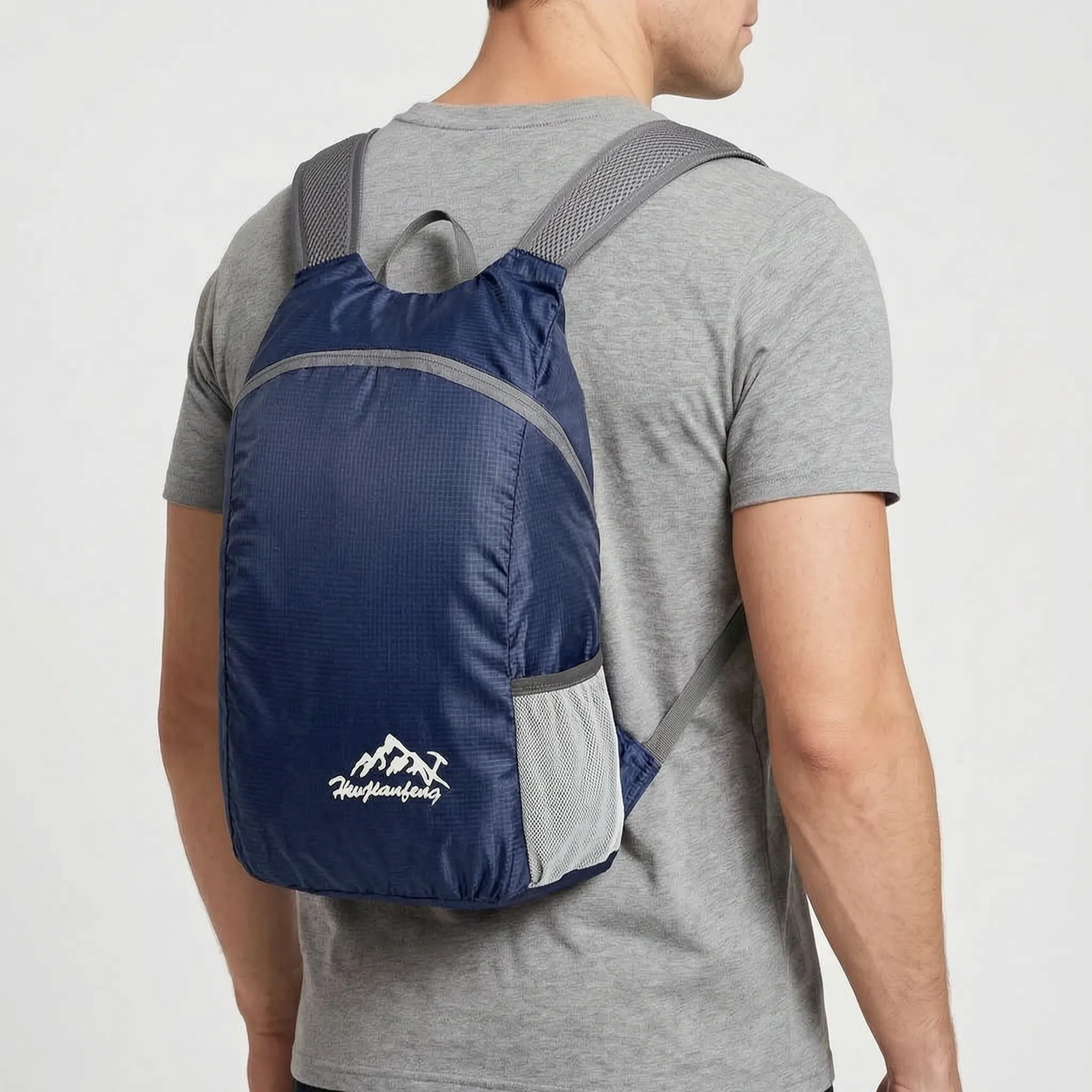 Foldable lightweight daypack with water-repellent outer shell and ventilated mesh straps