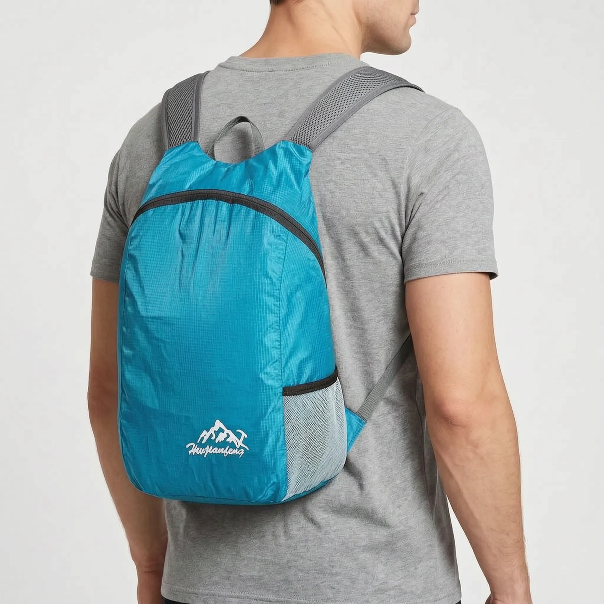 Foldable lightweight daypack with water-repellent outer shell and ventilated mesh straps