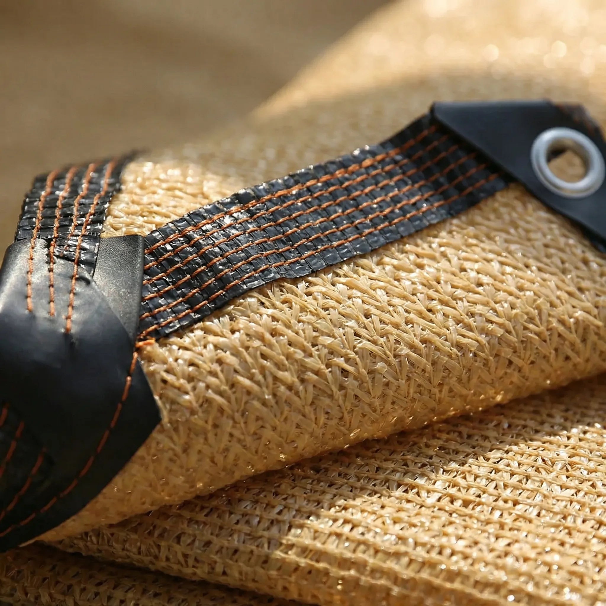 High coverage shade cloth with reinforced edges and metal eyelets for patio and garden use