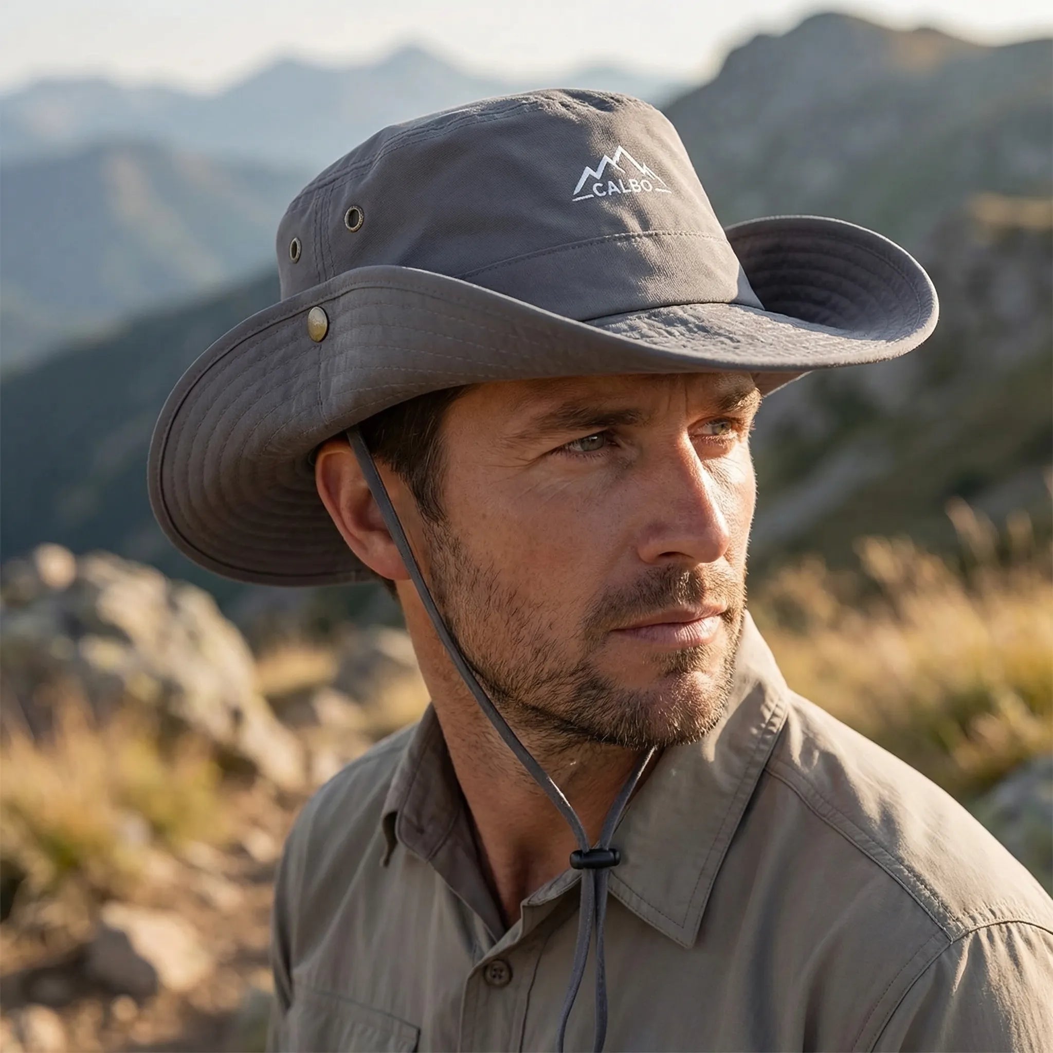 Wide-brim outdoor hat with waterproof quick-drying construction and adjustable chin cord