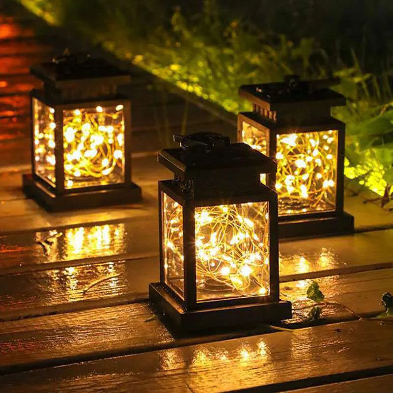 Solar-powered outdoor garden lantern with warm candle-effect glow