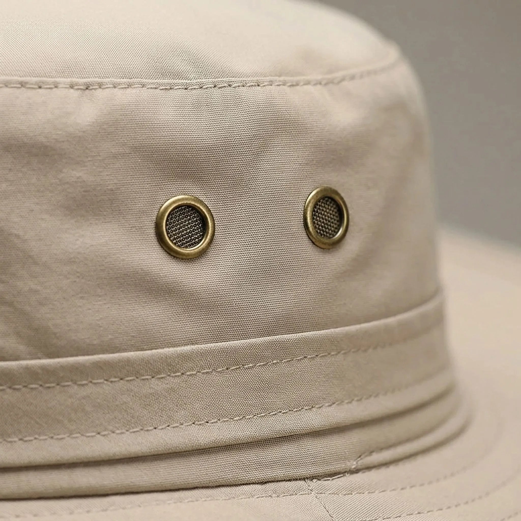 Wide-brim sun hat with ventilation eyelets and adjustable chin strap