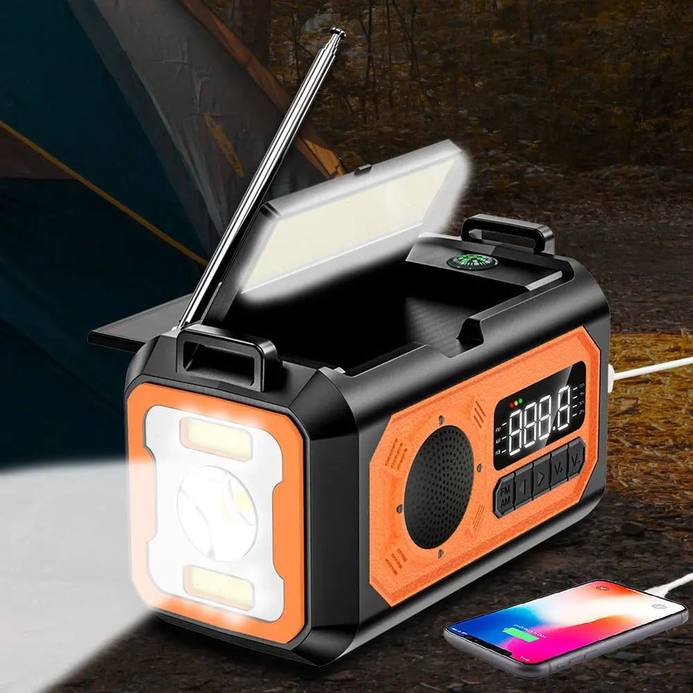 Portable emergency radio with solar panels and hand crank charging