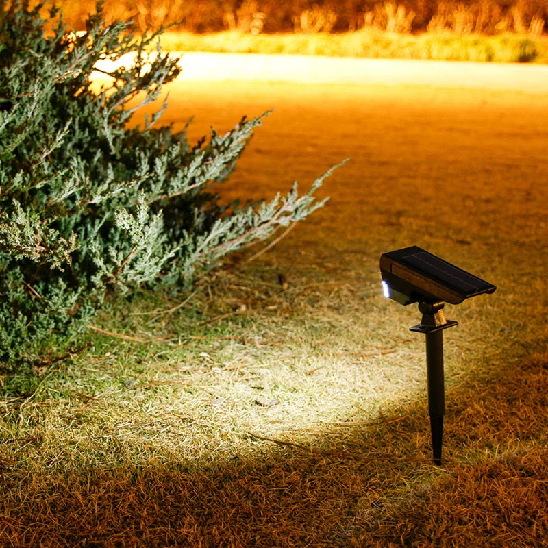 Solar-powered outdoor ground spotlight with 10 LED warm light and adjustable beam