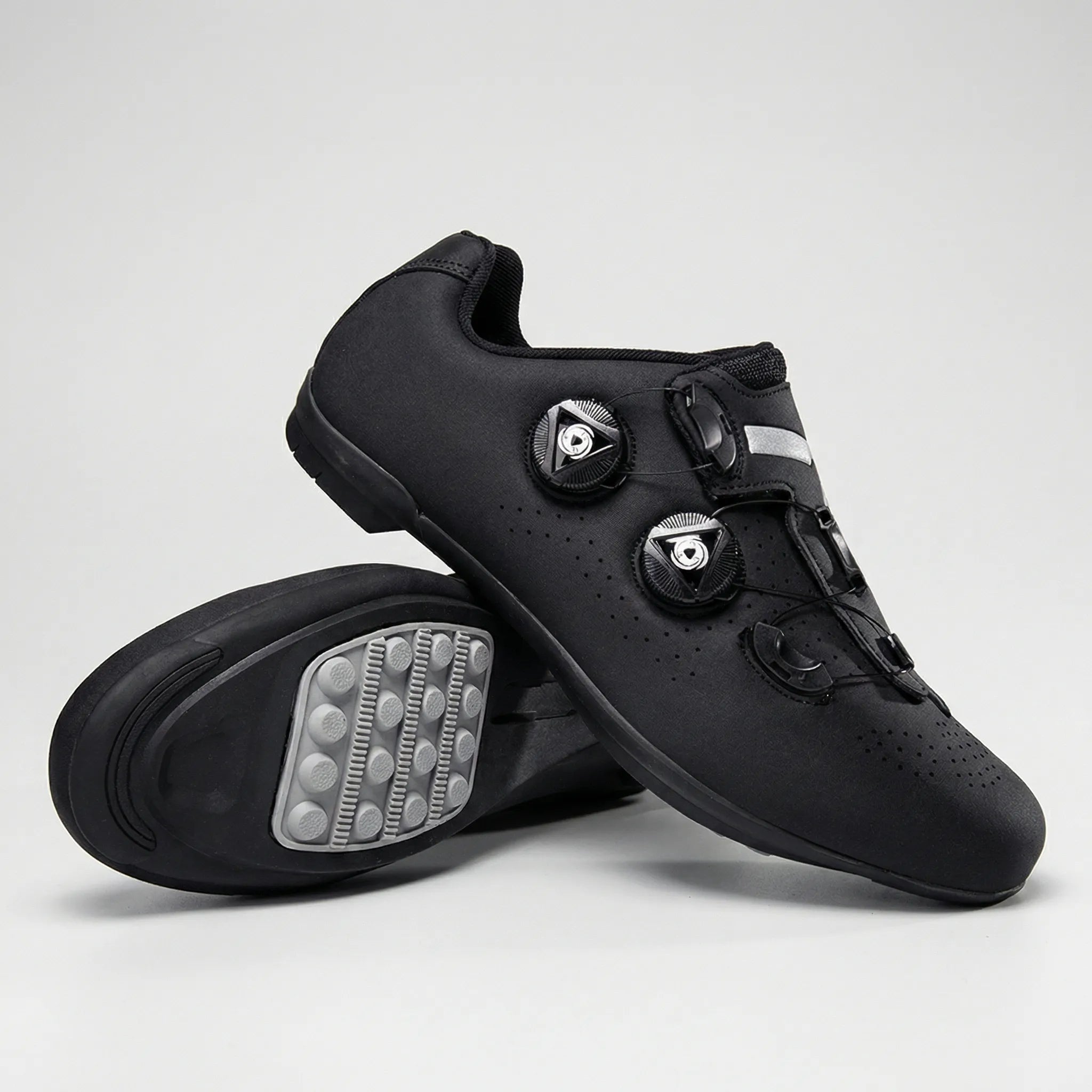 Self-locking cycling shoe with dual dial closure and perforated upper