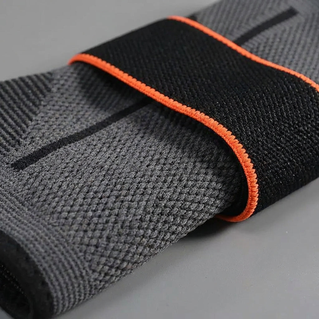 Adjustable compression ankle brace with breathable design