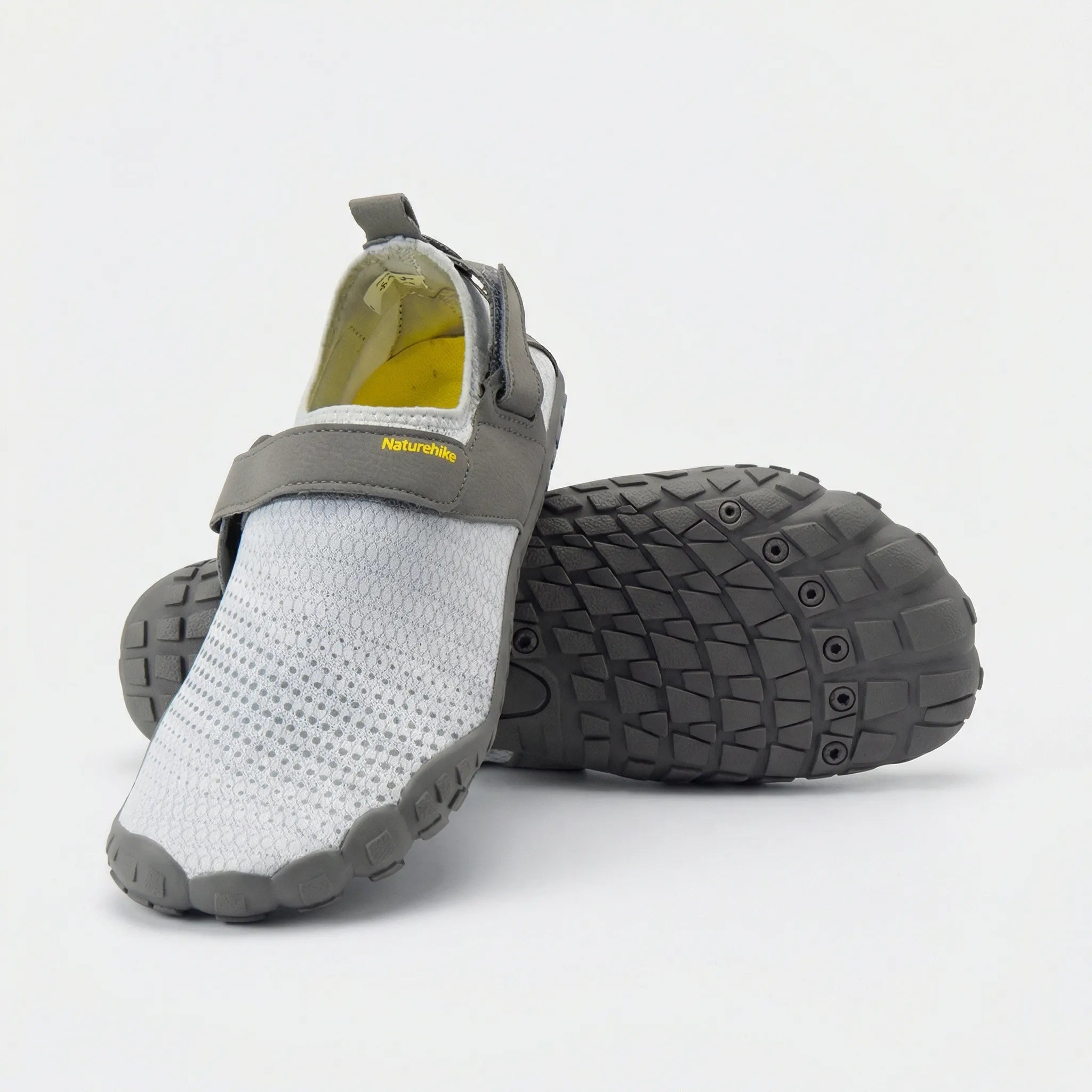 Quick-drying water shoes with non-slip sole, breathable mesh upper, and adjustable hook-and-loop strap