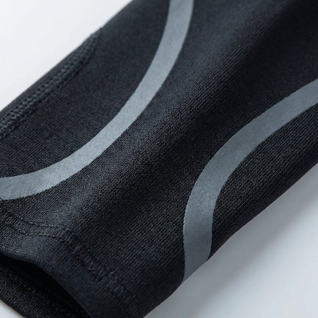 Low profile ankle support with adjustable compression for sports