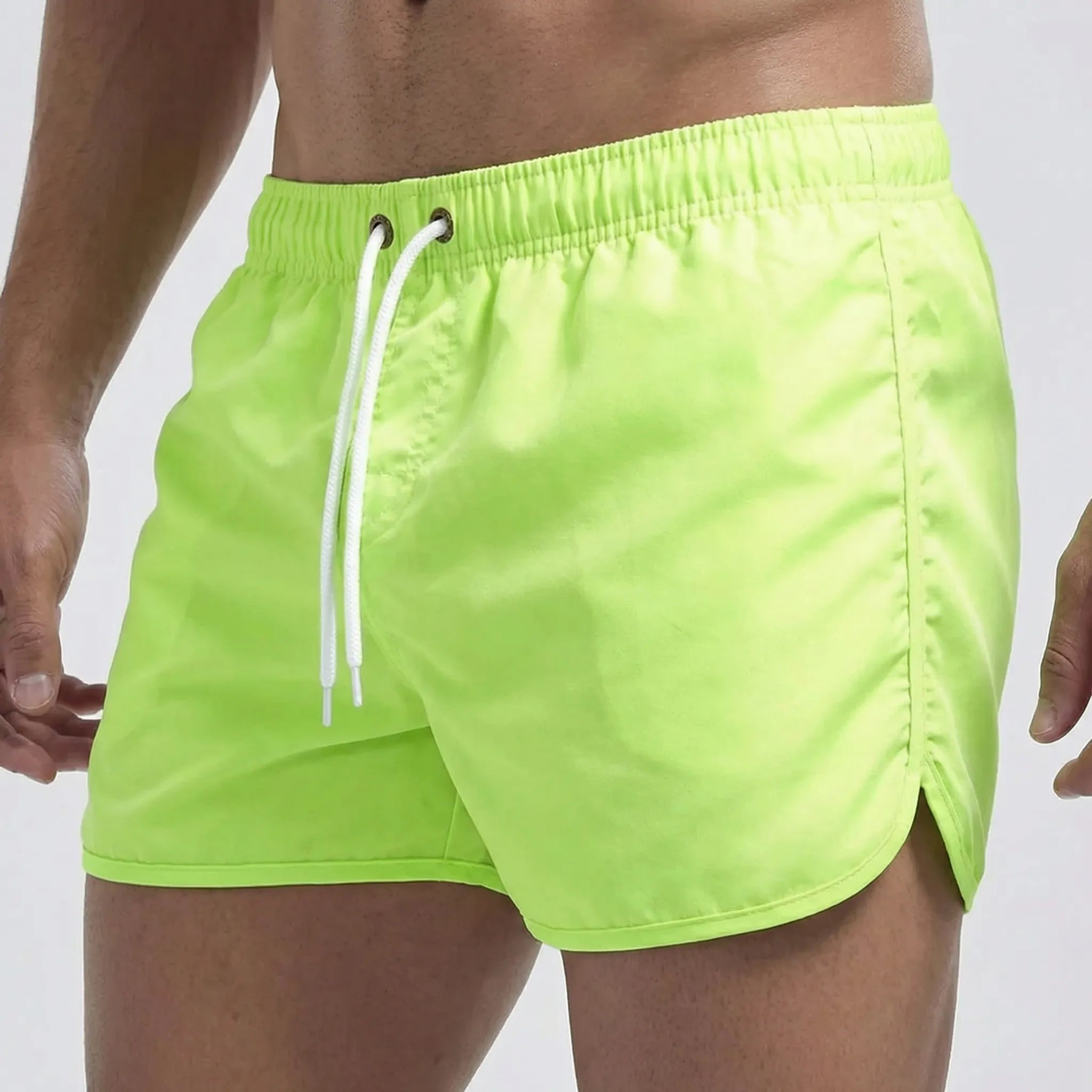 Men's low waist swim shorts with adjustable draw cord and curved hem