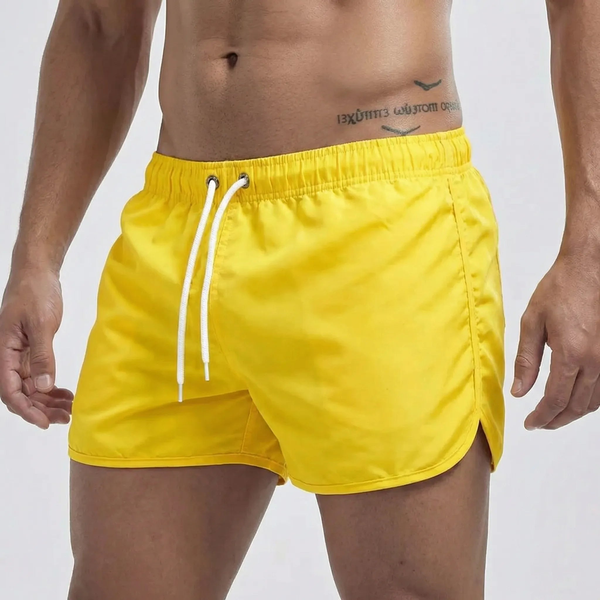 Men's low waist swim shorts with adjustable draw cord and curved hem