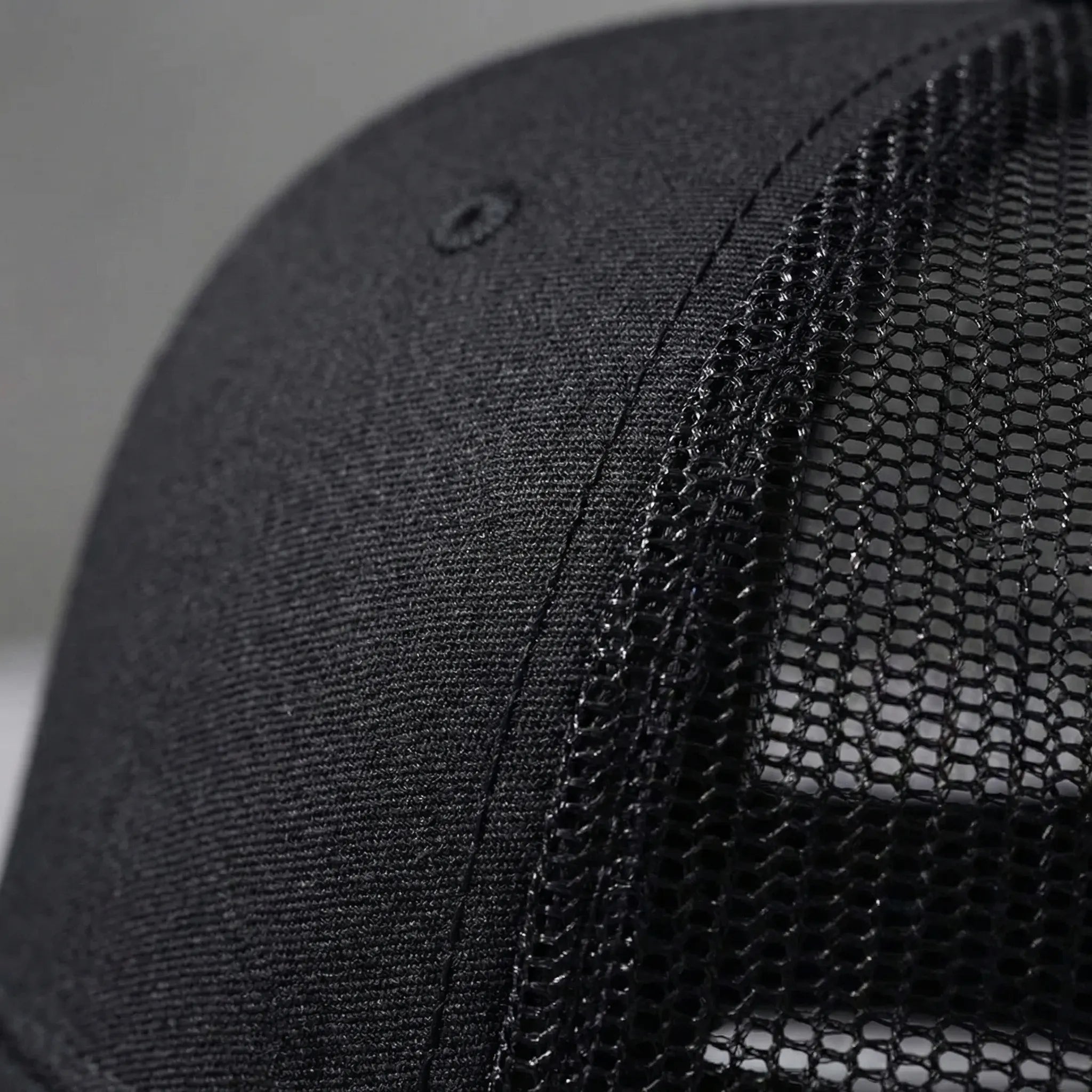Unisex trucker cap with curved brim and breathable mesh back panel