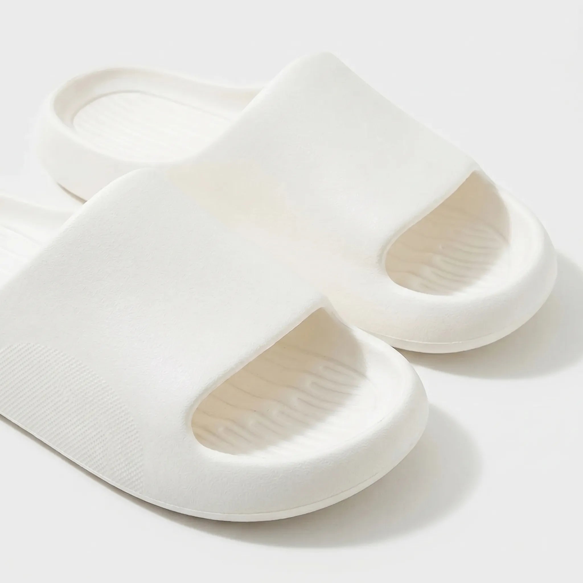 Chunky clog slippers with thick platform sole, open toe design, structured footbed