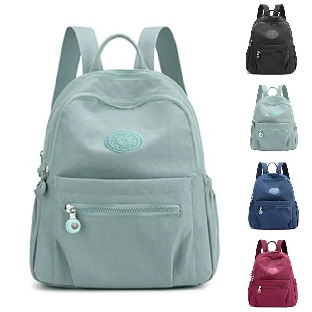 Compact mini backpack with anti-theft design and water-resistant fabric