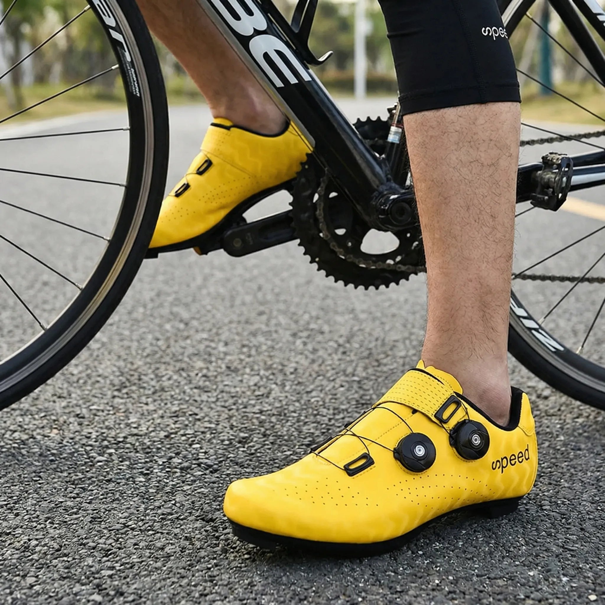 Hard-soled road cycling shoe with SPD cleat compatibility and dual rotary dial