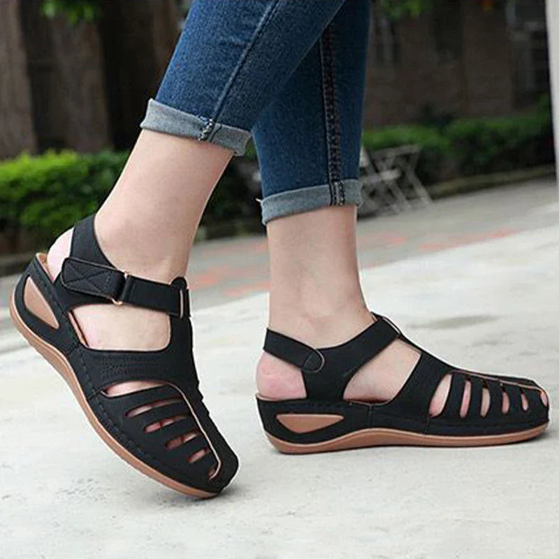Women's summer sandal with low wedge heel, adjustable strap, and wide toe box