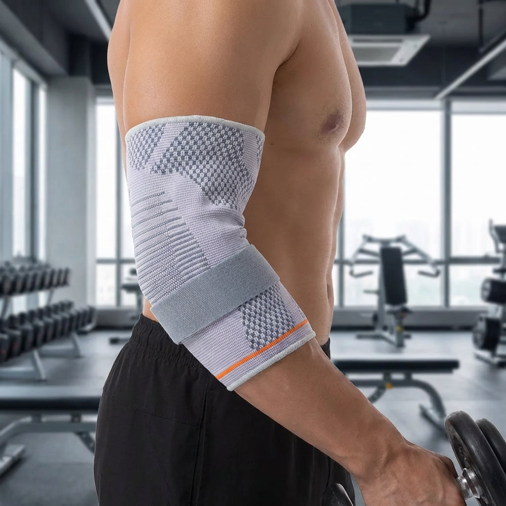 Adjustable compression elbow brace with padded support and breathable knit
