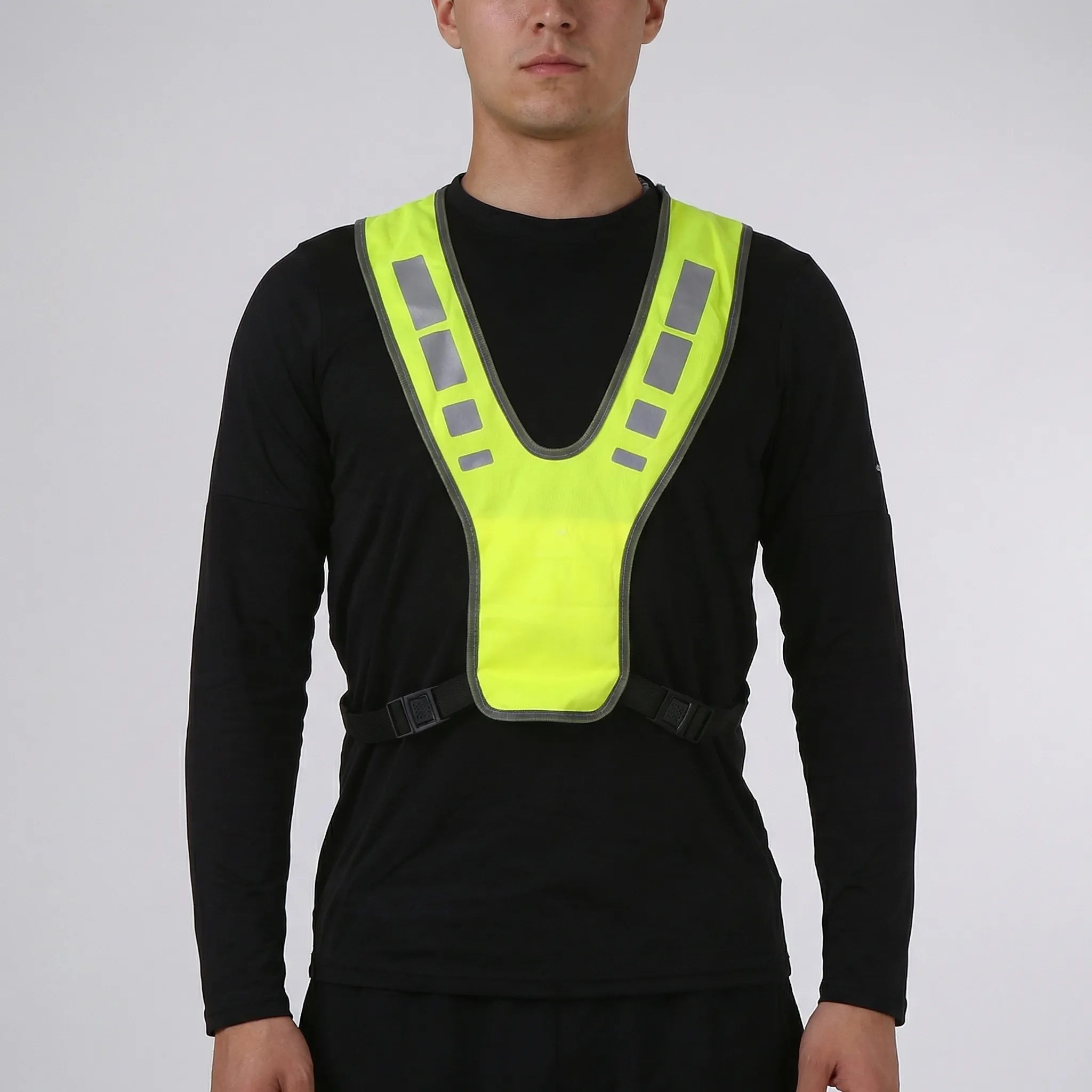 High-visibility running vest with reflective panels and V-harness design
