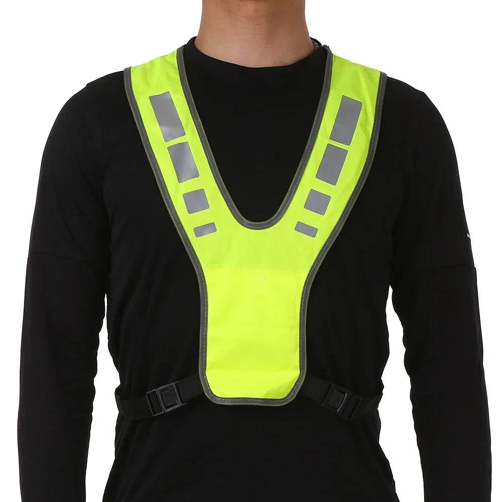 High-visibility running vest with reflective panels and V-harness design