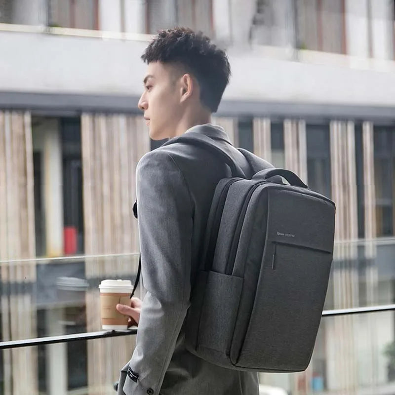 Water-resistant laptop backpack with padded compartment and shoulder straps
