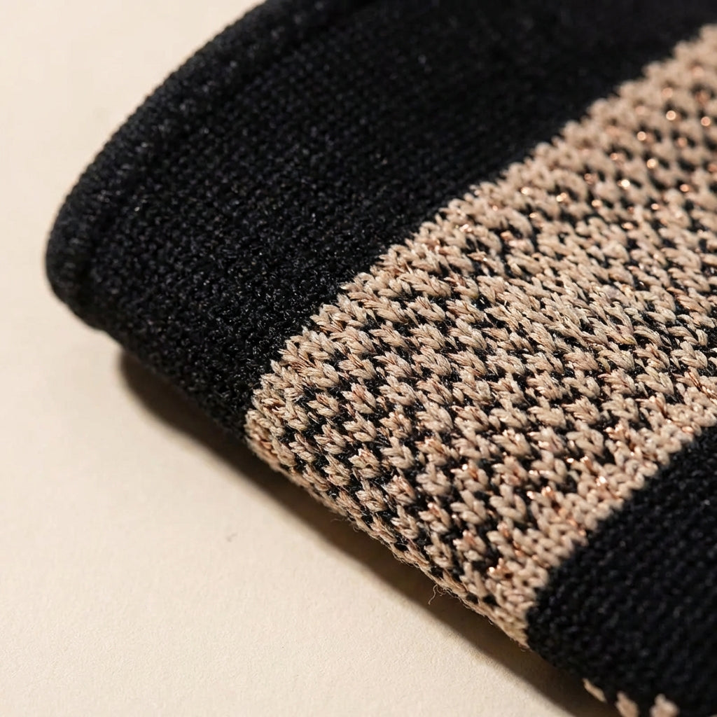 Compression wrist sleeve with targeted wrist and thumb support