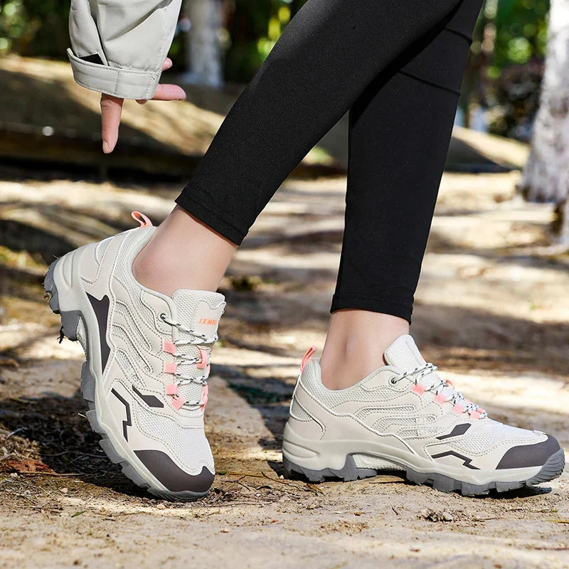 Women's waterproof hiking shoe with ankle support and tread pattern
