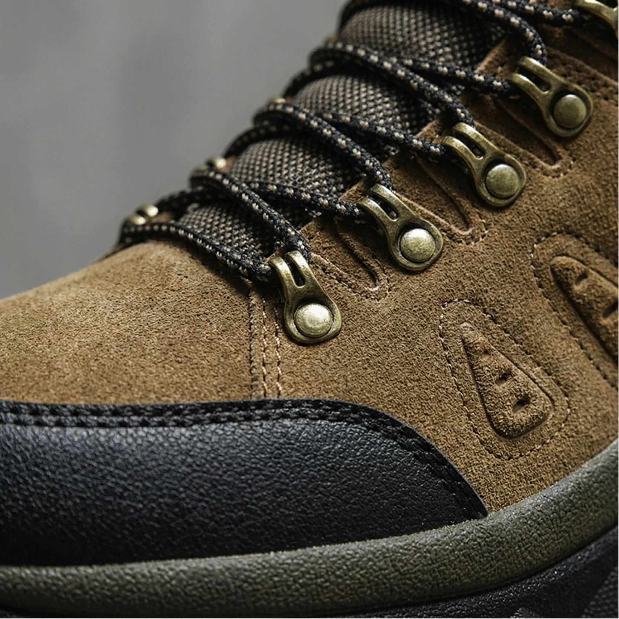High-top hiking boots with deep tread pattern and padded ankle collar