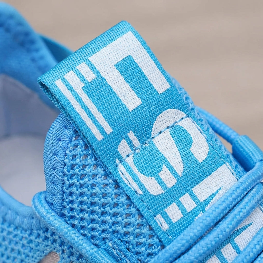 Low profile running shoe with breathable knit upper and padded sole