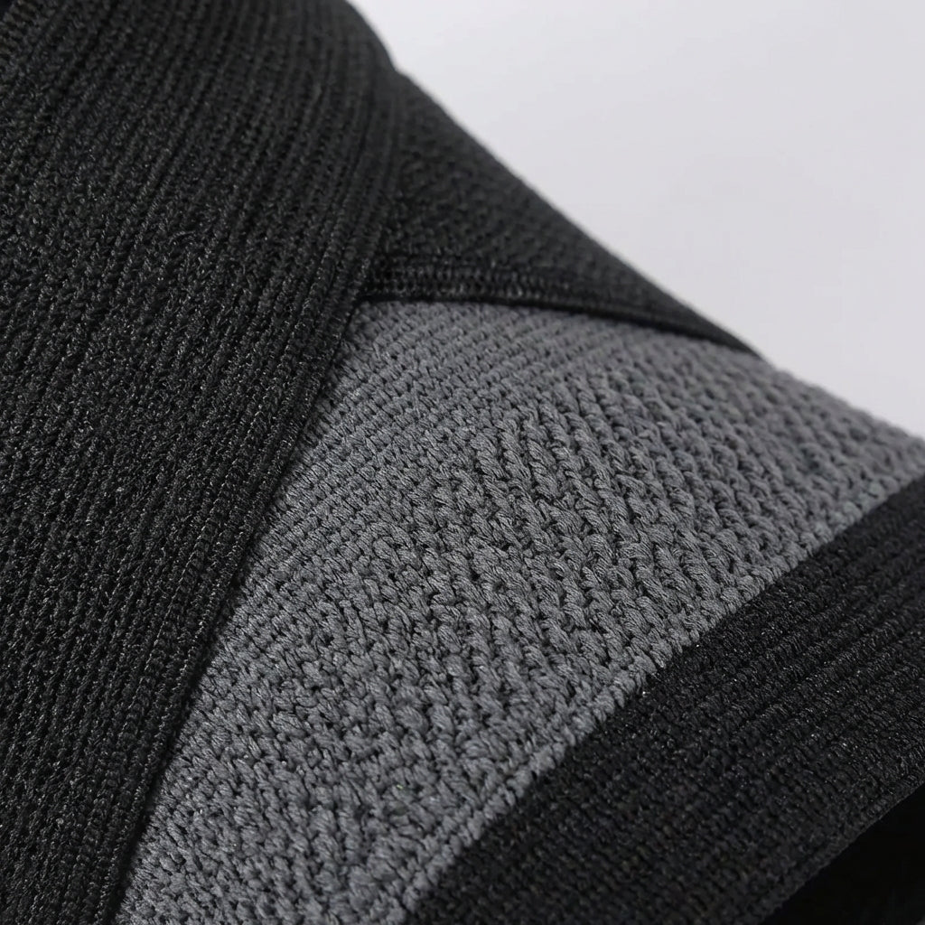 Adjustable ankle compression brace with wrap-around support